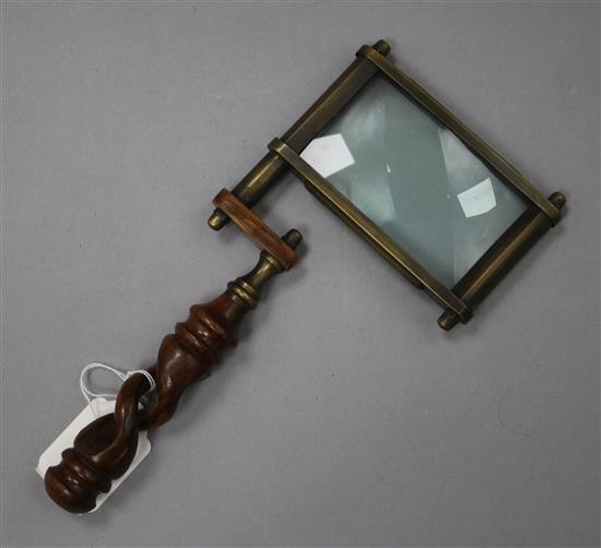 A Victorian carved wood handled brass magnifying glass length 26cm